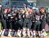 The Cheshire softball team celebrates during its 13-0 win over Hamden last Friday at Cheshire High School.