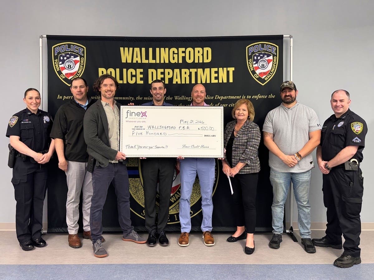 Wallingford Police Detective Sean Houlihan was recently honored by Finex Credit Union for helping three Finex members recover more than $3,000 stolen in a phone scam.