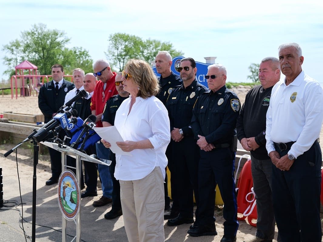 West Haven Mayor Dorinda Borer, joined by city and public safety officials, announces an “aggressive” water safety program for beaches and pools during a news conference at Sea Bluff Beach on Friday.