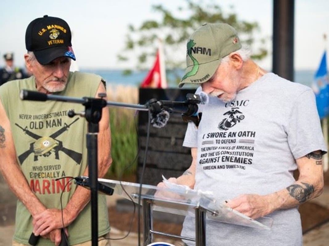 West Haven Vietnam Veterans President Dave Ricci, right, is joined by member Howie Thomas for a reading of an Apache blessing at the city’s dedication of 50 new bricks on the Veterans Walk of Honor and eight new names on the Vietnam Veterans Memorial.