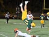 Hamden freshman quarterback Soren Wallin is upended by a Lyman Hall defender in Friday’s 36-12 loss at Hamden High School.