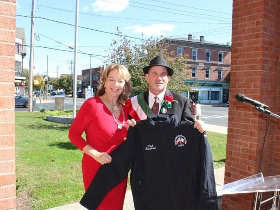 2026 West Haven Italian American of the Year Paul M. Frosolone receives an embroidered jacket from Mayor Dorinda Borer at the city’s 27th annual Italian Heritage Celebration on the front steps of City Hall on Friday, Oct. 9.