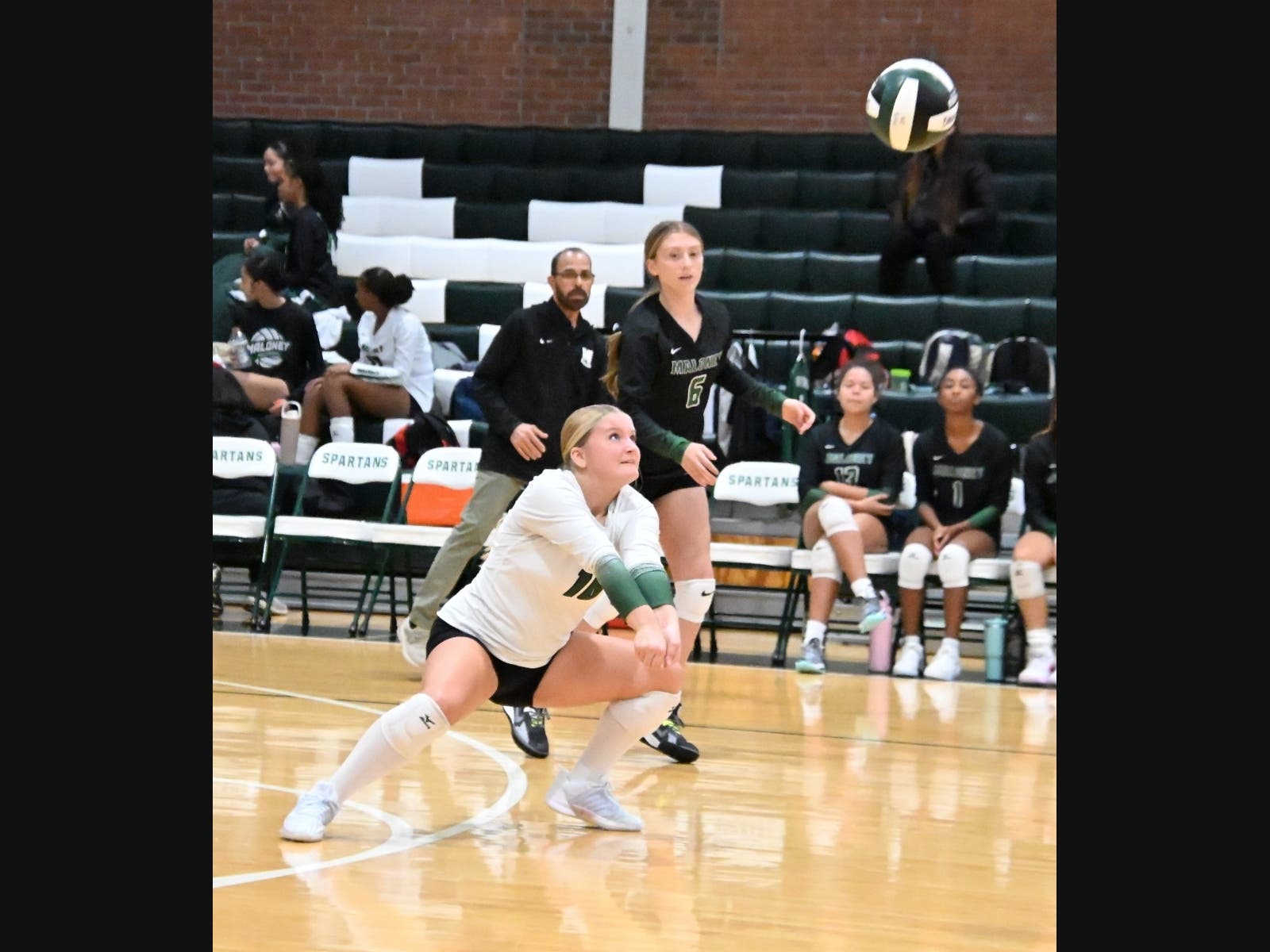 Maloney sophomore Lucy Fisher sets the ball in a recent game. The Spartans beat Middletown on Thursday to improve to 17-2.