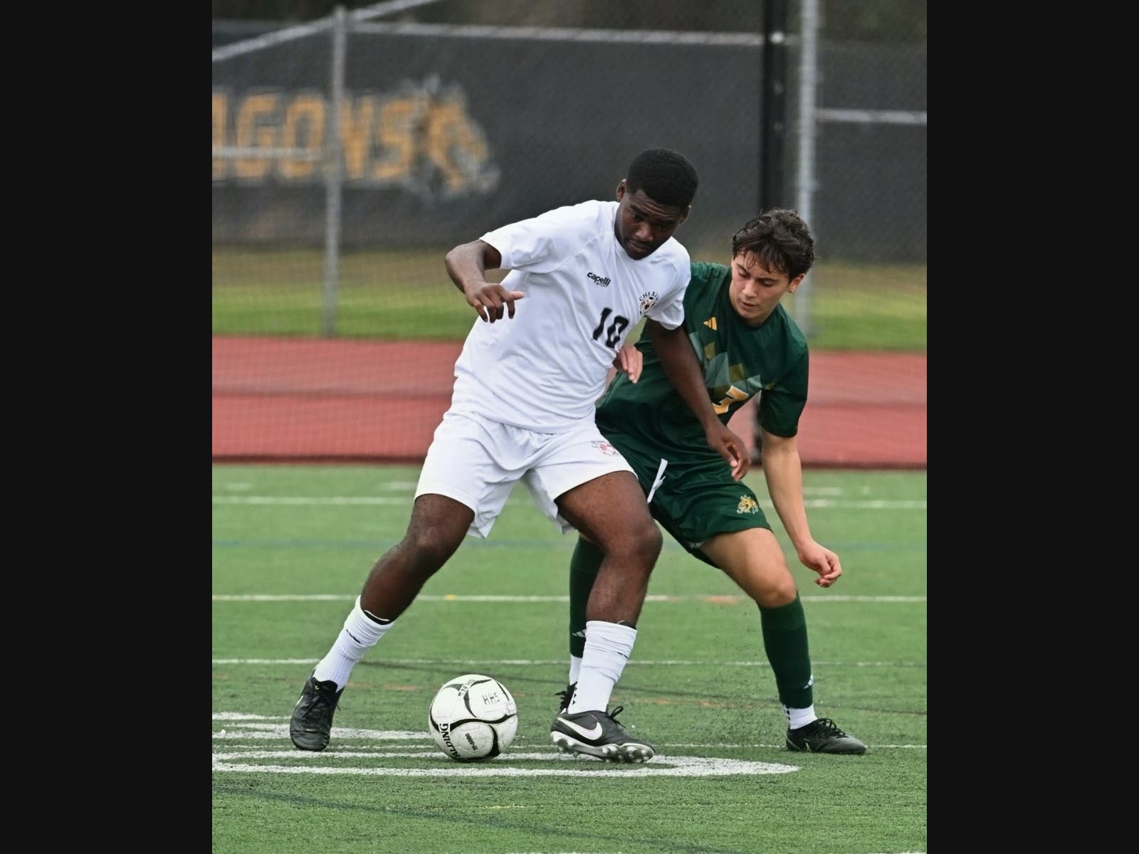 Cheshire senior Jaymin Emede controls the ball during a recent game against Hamden.