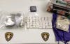 More than a half-pound of marijuana and 48 heroin bricks, worth about $10,000 on the street. 
