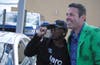 Tom McMenamin takes a photo with a happy customer. 
