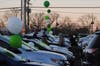 People stake out cars. More than 50 people were there by 6 a.m. and by 7 a.m. nearly every car had someone waiting. 