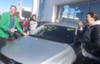 Abby Entwistle of Red Bank reacts as Tom McMenamin cuts the price of the car she's chosen to $1. 