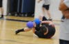 A player gets hit as he tries to avoid a throw at the Toms River PBA Dodgeball Tournament at Toms River East.
