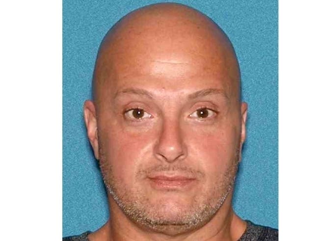 Brian D. Swain, 48, is accused of hitting the detective with his car and trying to leave the scene.