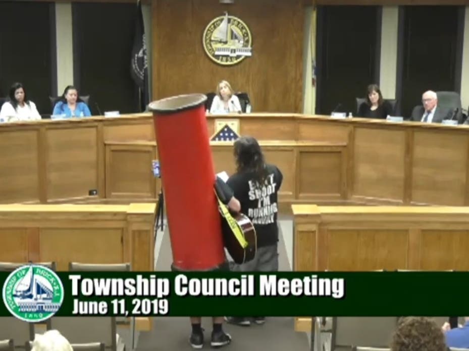 Marijuana activists perform a song at the Brick Township Council meeting last week. 