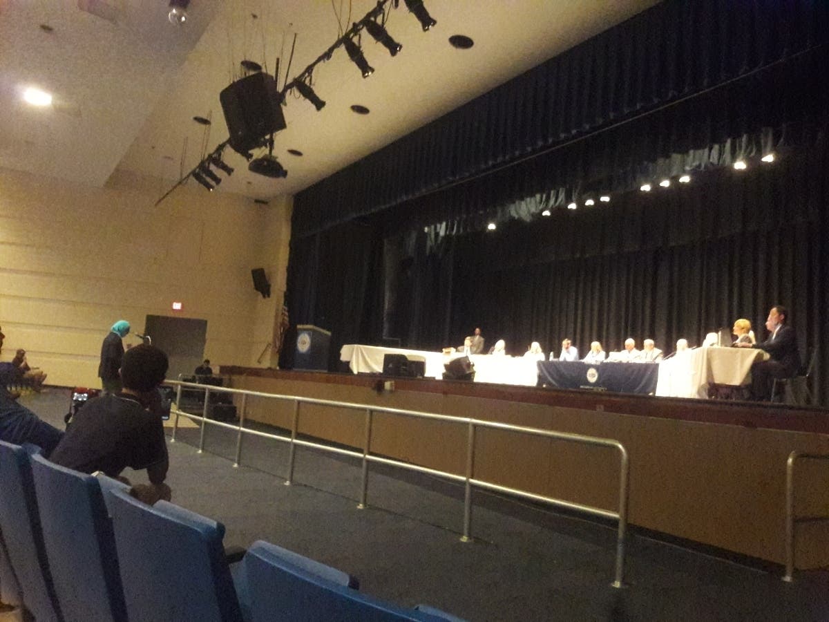 Azra S. Baig, a South Brunswick school board member, criticizes Facebook posts by Toms River board member Daniel Leonard at the meeting.