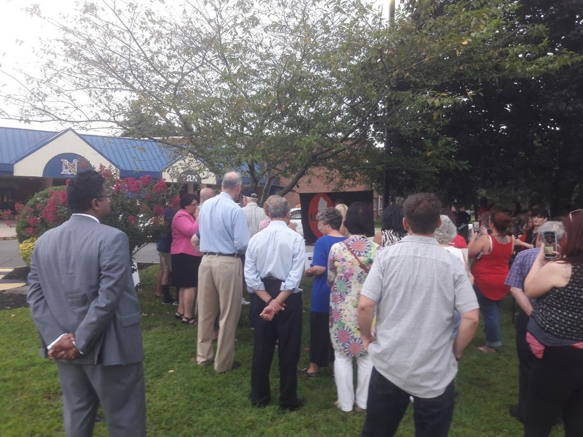 Prostesters gather outside Toms River High School North on Wednesday evening to renew their calls for Dan Leonard to resign. 