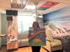 Hannah Donner displays one of the painted ceiling tiles that have been installed in the K. Hovnanian Children's Hospital at Jersey Shore University Medical Center, part of her way to give back to the hospital where her life was saved.
