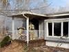 Firefighters go into a home on Ridgeway Road in Manchester that was destroyed by a fire on Friday.