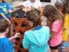 Students care for plants growing in a tower. 