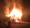 The house caught fire on Wednesday afternoon and reignited early Thursday morning, police said. 
