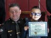 South Toms River Police Chief William Kosh and Miguel Alarcon after Miguel was named honorary special police officer. 