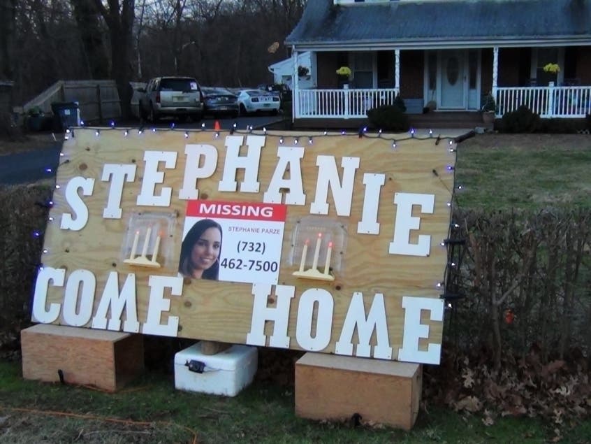 The sign in front of the Parze family home is both a plea to their daughter, Stephanie, and a fervent hope. 