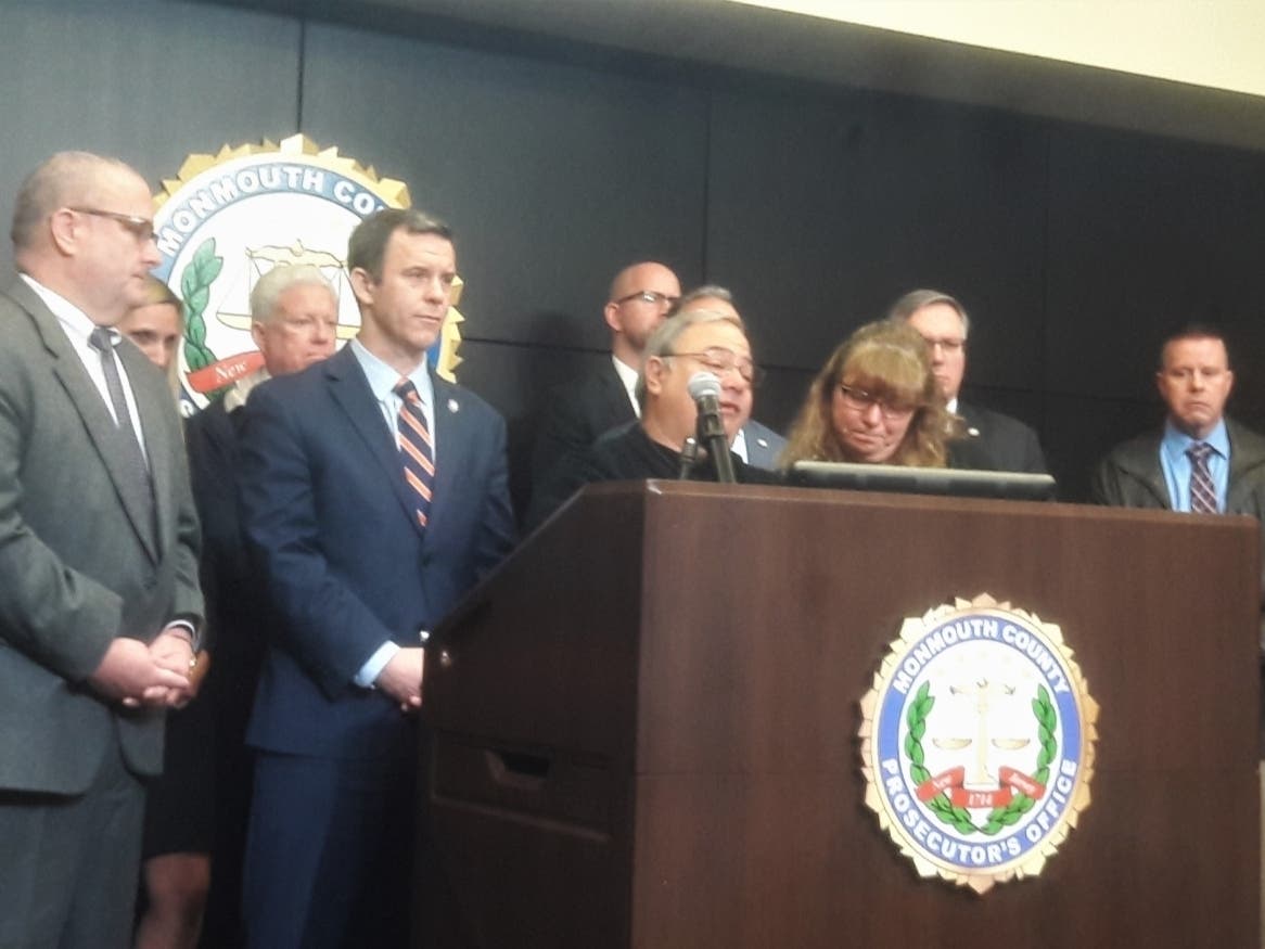 Ed Parze, with his wife, Sharlene, speaks about the family's plans to create the Stephanie Parze Foundation to help domestic violence victims and help those searching for missing loved ones on Monday at a news conference about the death of their daughter.