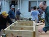Toms RIver Rotary Club members put the finishing touches on the frame of one of the steps. 