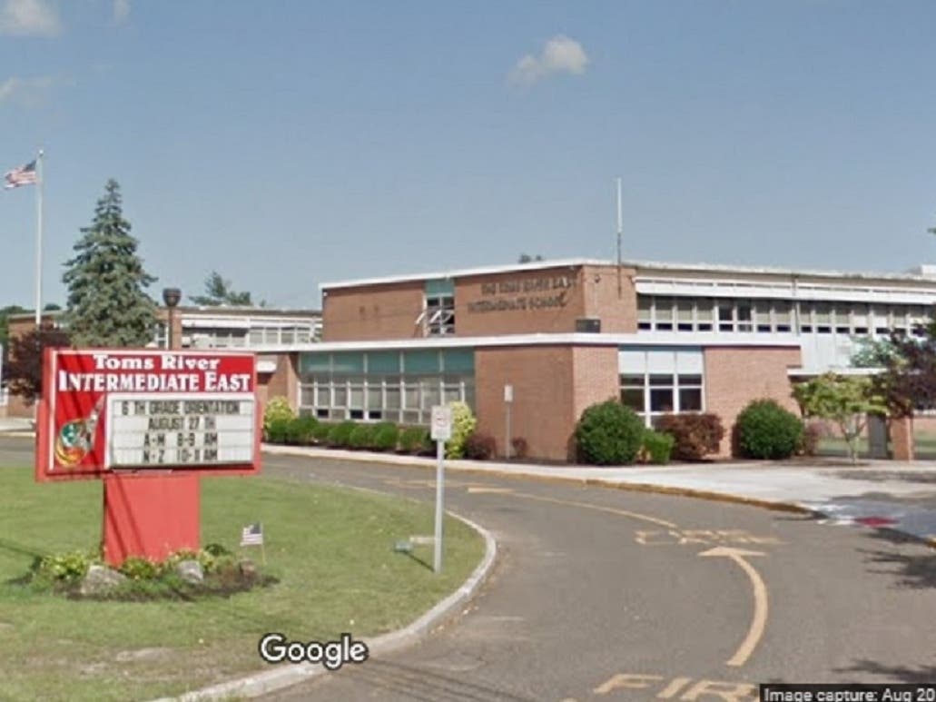 Toms River Intermediate East teacher Lawrence Cuneo was trying to get across "the appalling but ... real facet of our nation's history," the district said.