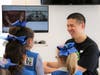 Dr. Ernest Wang talks to members of one of the Girl Scout troops that visited during the event.