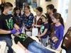 Girl Scouts listen as Dr. Wang explains a dental exam. 