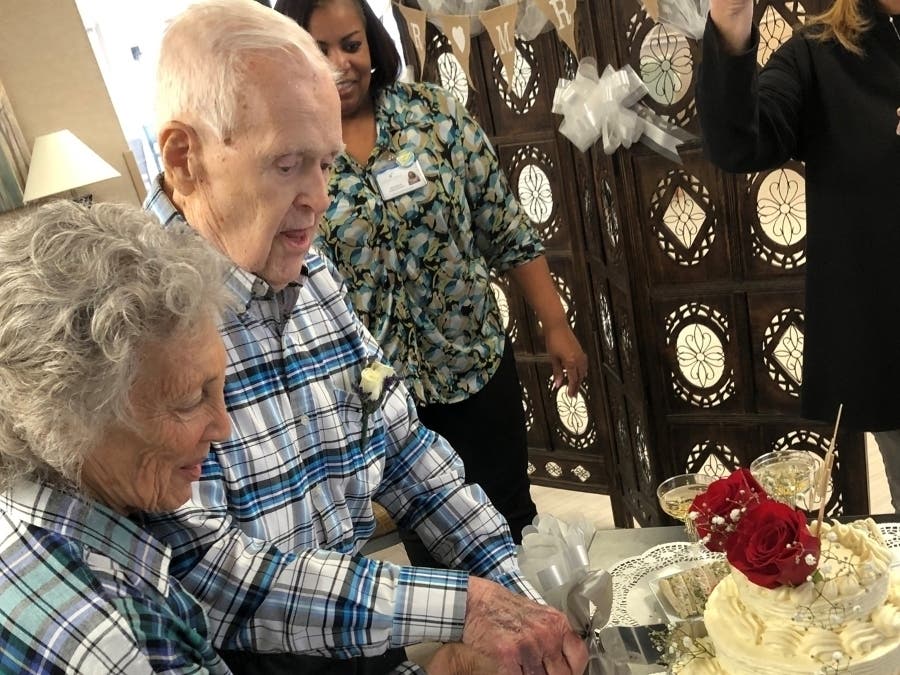 Ronnie Freeman and Edgar Smith cut the cake after the couple were married in a recent ceremony at the nursing home. 