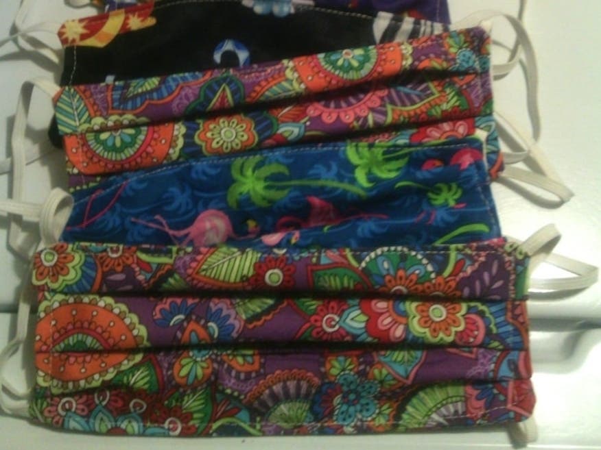 Some of the masks Glenda Dunlap has made and donated to nurses and cancer patients in need. 