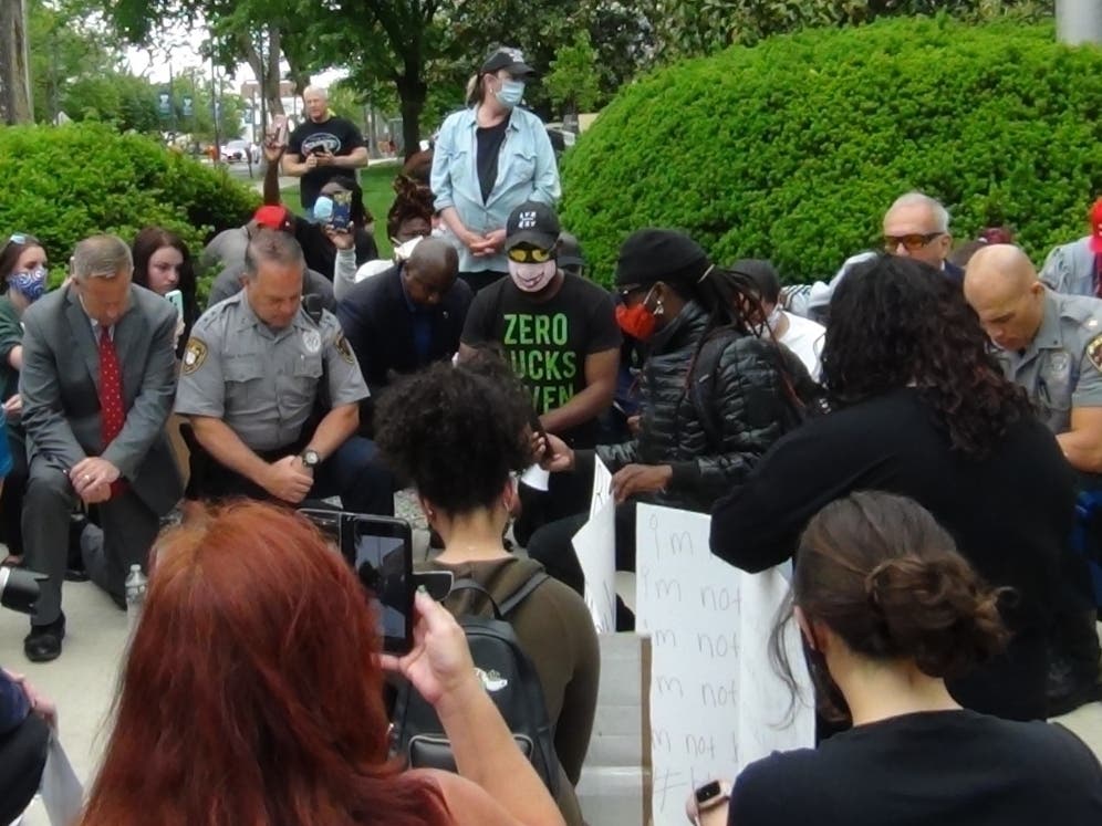 Toms River Police Chief Mitch Little and other law enforcement kneeled with demonstrators in Toms River on Tuesday in a show of unity.