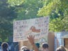 A protester holds a sign during the Black Lives Matter demonstration in Brick on Monday. 