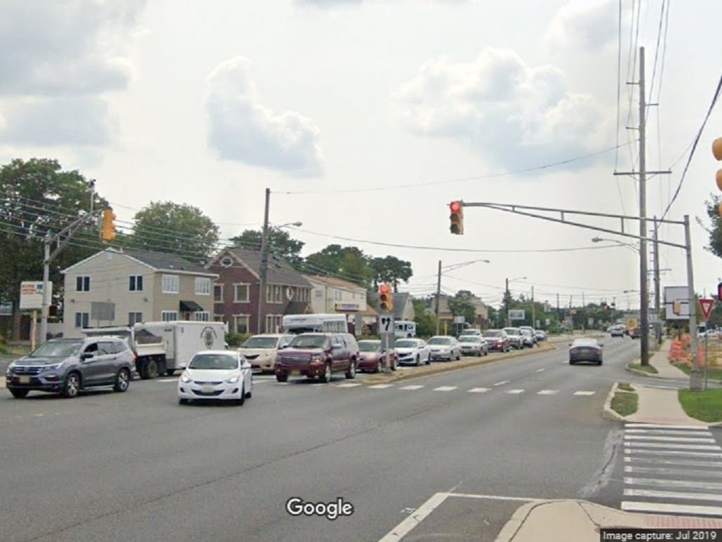 Traffic backs up on Chambers Bridge Road waiting to turn left into the Kohl's shopping center. The traffic backs up frequently because that is the most popular entrance to the shopping center. 