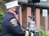 Ringing the bell to honor the firefighters who gave their lives trying to rescue those in the World Trade Center.