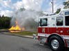 A large propane fire burns at the site Sunday in Brick during a disaster preparedness drill.