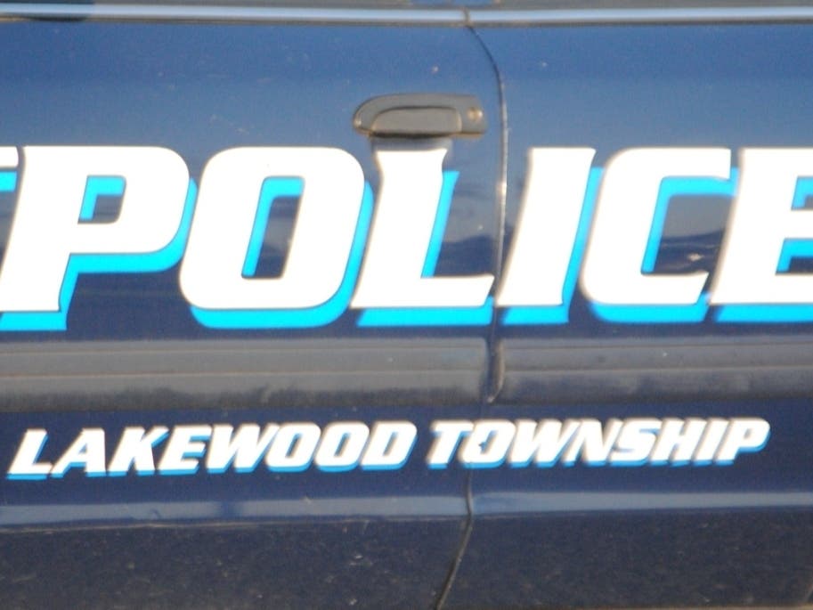 Lakewood police said two men were arrested on weapons charges after authorities found a .357 revolver in their vehicle. 