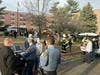 Brick police, fire and EMS personnel monitor the scene after a fire in a third-floor apartment at the George Conway Tower on Saturday.