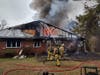 Firefighters battle the blaze on Willow Court in Whiting on Friday morning. 