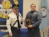 Brick Sgt. Jim Kelly (right), with Police Chief James Riccio, after Kelly was honored for his service to the county as an instructor at the Ocean County Police Academy.
