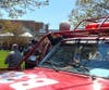 Brian Sauers waves from the step of New Jersey Forest Fire Service truck No. 33 as he leaves Shore Rehabilitation Center in Brick, six weeks after suffering a medical event while fighting the forest fire on the Brick-Lakewood border.