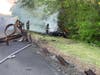 Firefighters extinguish the car fire after a BMW went through guardrails on the southbound shoulder of the Garden State Parkway on Monday. 