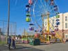 A pair of students stand near the Ferris wheel that was brought in for the Toms River South prom.