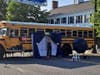 A photo backdrop was set up against a Toms River Regional Schools bus. 