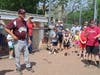 Ken Frank addresses the crowd that included his wife, Cecelia, his children and grandchildren, and former players after the game. 