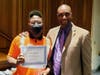 Allen Mitchell and Manchester High School Principal Dennis Adams. 