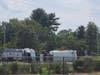 A garbage truck is on its side on Route 70 following a crash Wednesday afternoon.