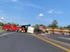 A Little Egg Harbor Township garbage truck is righted after it overturned on Route 70 on Wednesday. 