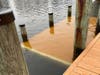 Water covers a step-down dock along a lagoon in Toms River on Thursday, when water rose from the combined effects of Tuesday's nor'easter and Friday's incoming costume. 