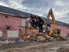 An excavator tears out wood and pipes and items left behind at the Bamboo Bar. Metal was being separated to go to recycling; the remainder will go to the Ocean County Landfill. 