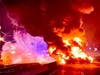 Gasoline from an overturned tanker burns on Route 37 early Wednesday morning. The road will remain closed for several more hours, Manchester police said. 